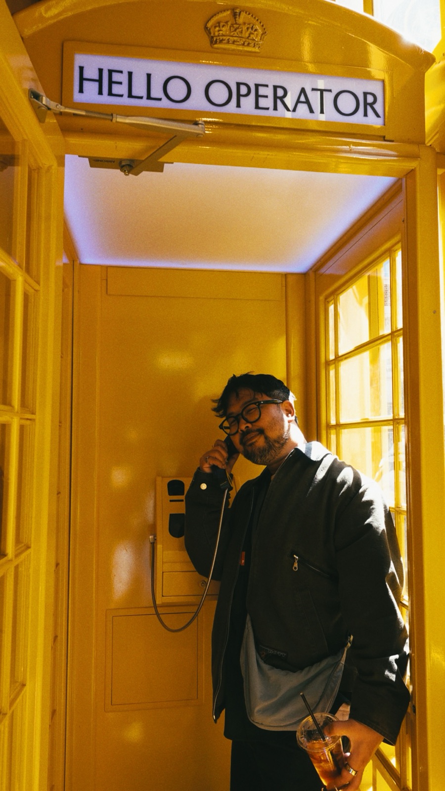 Tom Major in a yellow phone booth